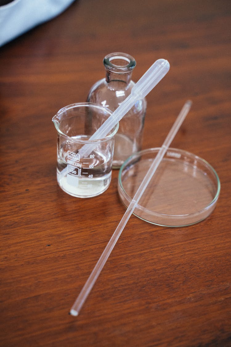 Dropper On A Beaker With Water 