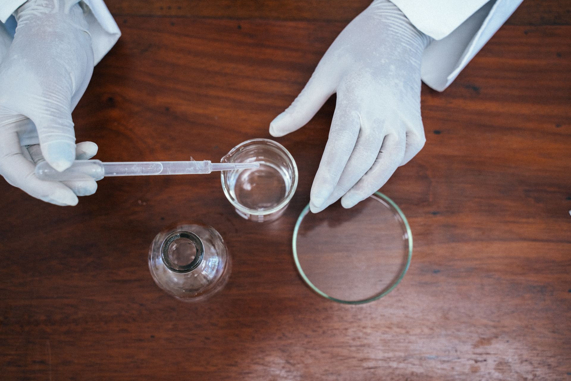 Close-Up Shot of a Person Experimenting in the Lab
