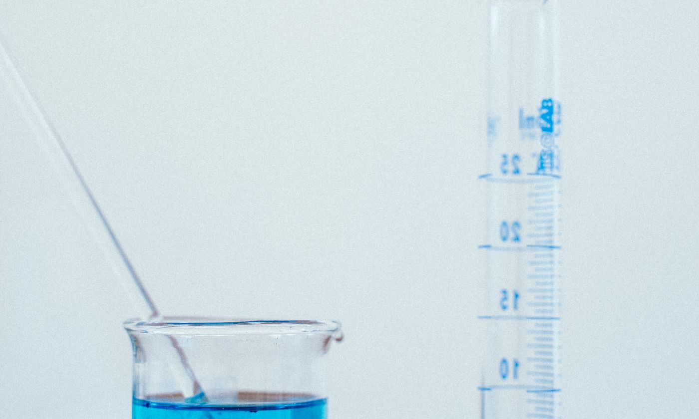 Laboratory beaker containing blue solution