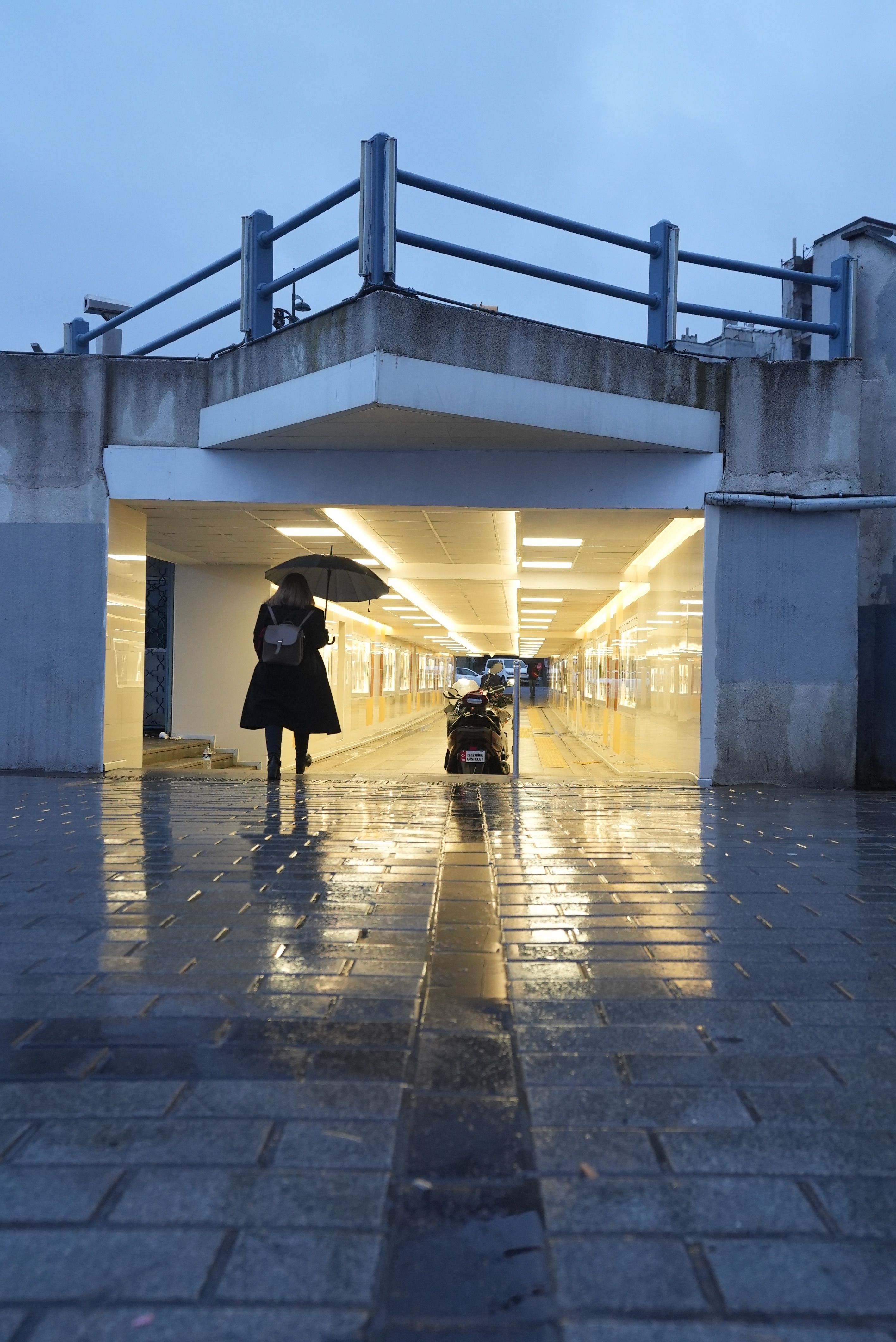Woman in Black Coat Walking on Sidewalk · Free Stock Photo