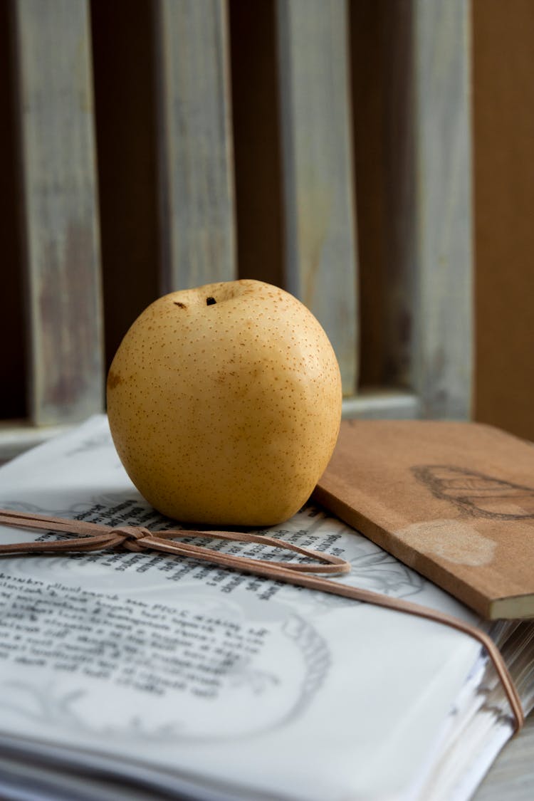 Stack Of Documents With An Apple On It 