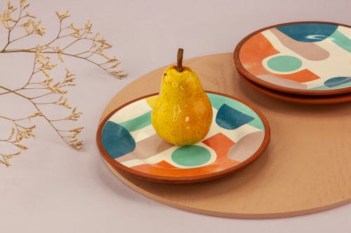 Pear on a Saucer with Colorful Design