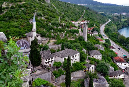Discover the historic charm of Počitelj, Bosnia, in this captivating aerial shot of the picturesque village.