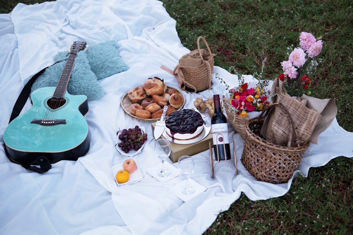 Picnic Blanket with Food and Acoustic Guitar