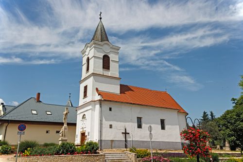Free Picturesque church with red roof in Balatongyörök, Hungary, under a bright blue sky. Stock Photo