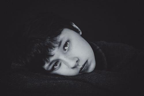 Free Grayscale Photo of a Short-Haired Woman Looking at Camera Stock Photo