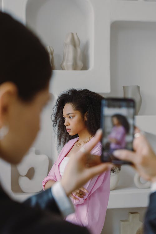 A Person Taking Photo of a Woman