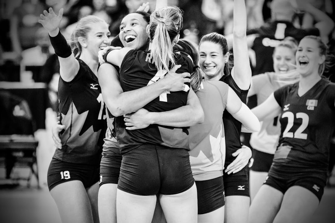 Volleyball Player Hugging Each Other