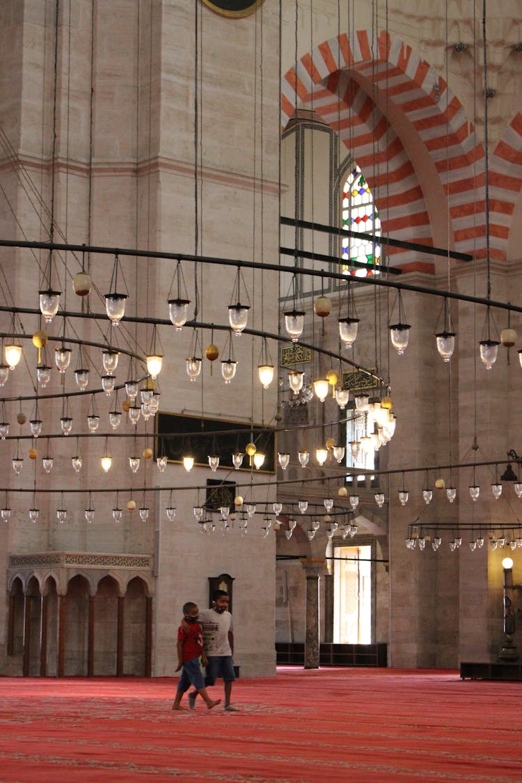 Kids Walking Inside A Mosque