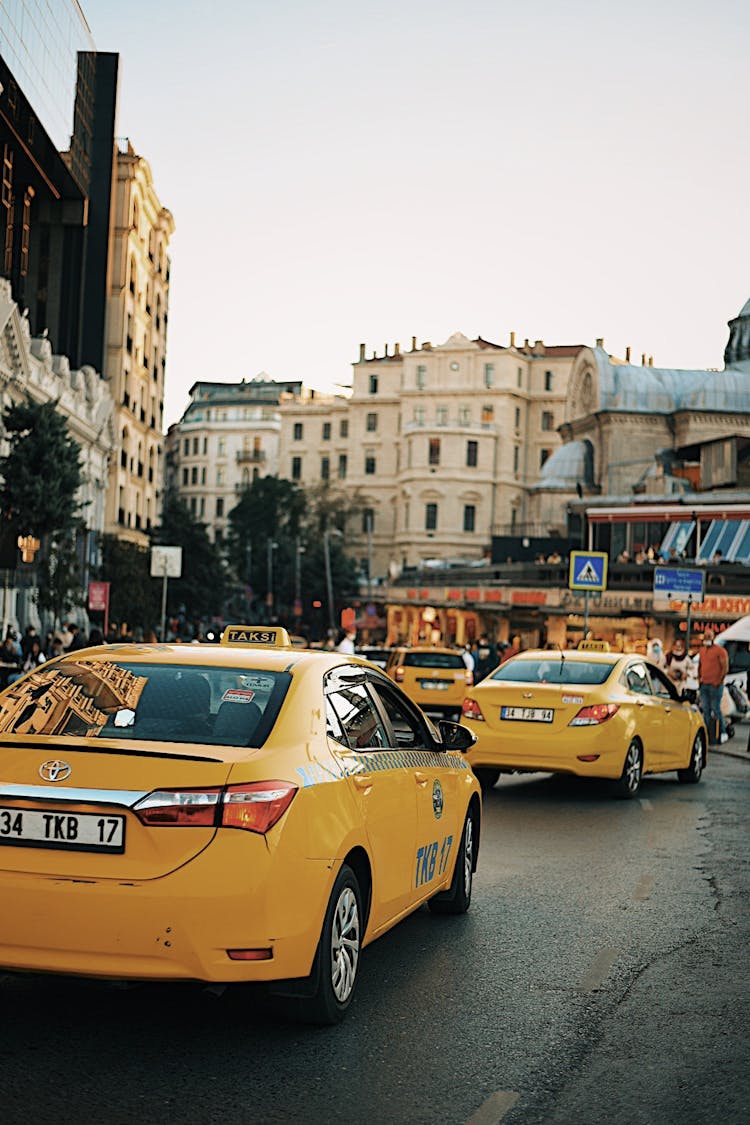 Yellow Taxis On Asphalt Road