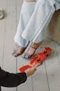 Woman Fitting Sandals in the Shop