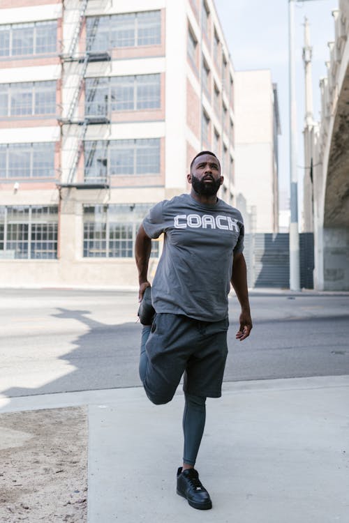 Man in Gray Shirt Doing Stretching