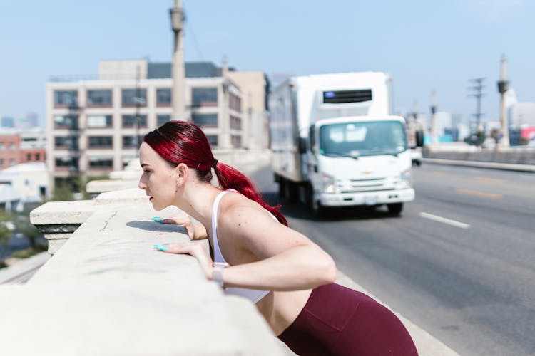 Woman Exercising Beside Road