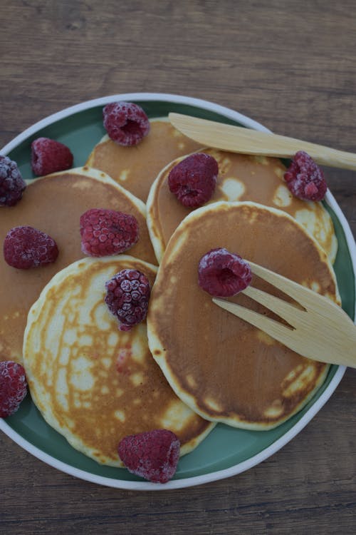 Free Pancakes with Raspberries on Ceramic Plate Stock Photo