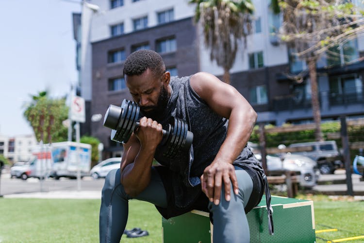 Man Exercising With A Dumbbell 