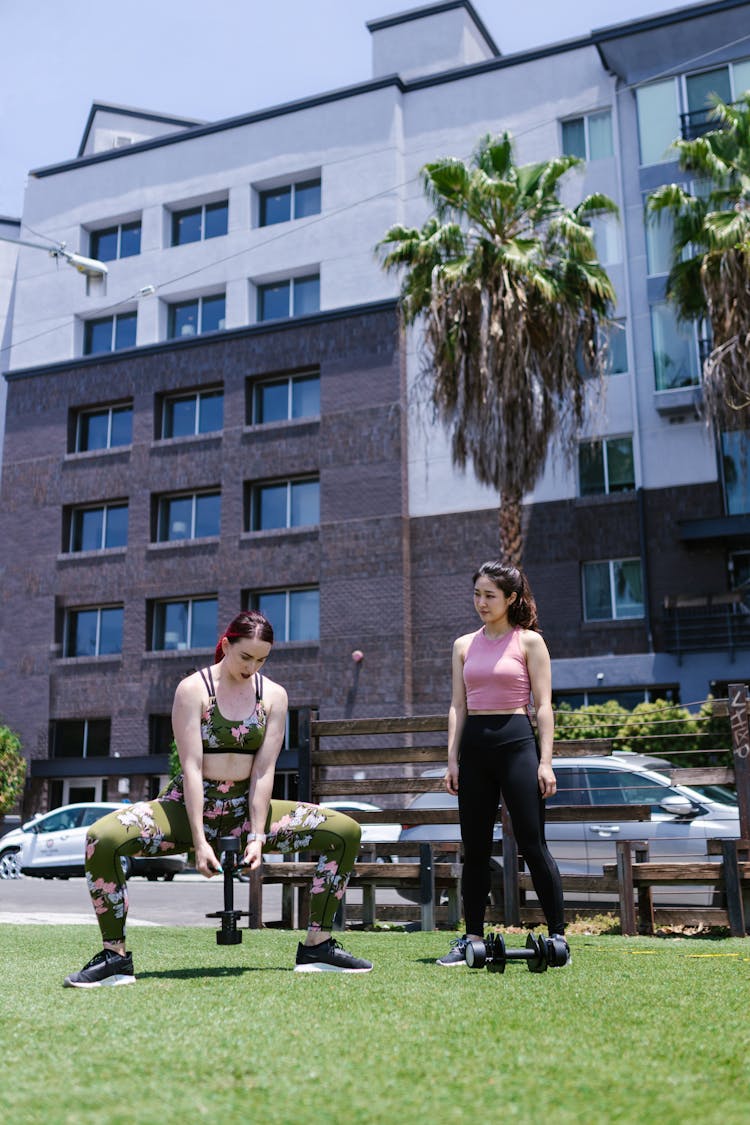 Women Lifting Dumbbells