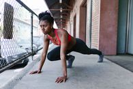 Woman Doing Stretching on the Walkway
