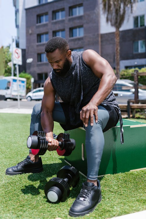 A Man Lifting Dumbbell while Wearing Virtual Goggles · Free Stock