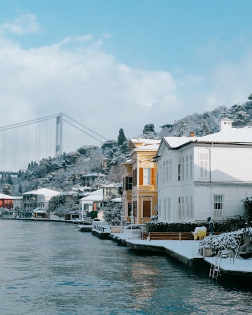 Snow Covered Houses Near the River