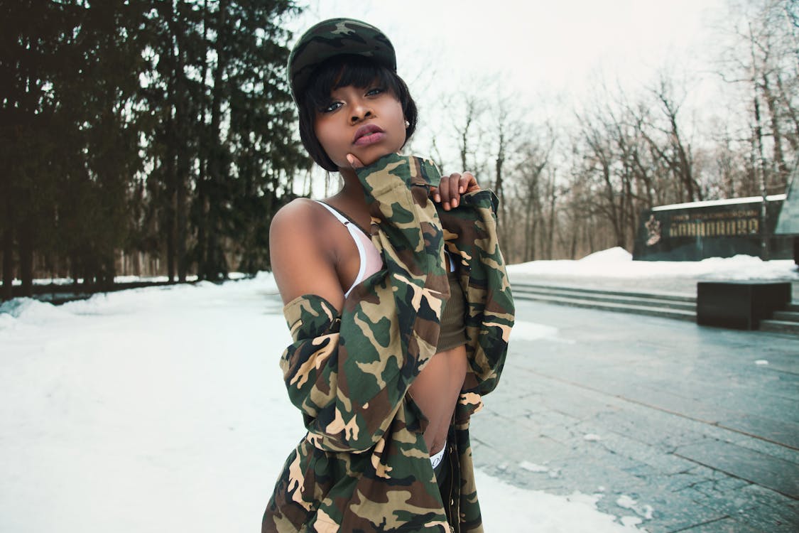 Free Woman Wearing Camouflage Shirt Covered by Snow Stock Photo