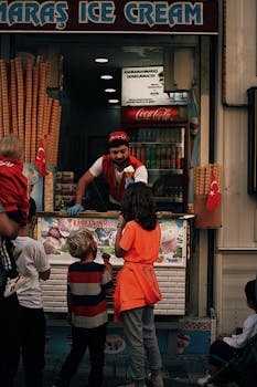 Kahramanmaraş ice cream vendor serving customers on a lively street in Istanbul, Türkiye.