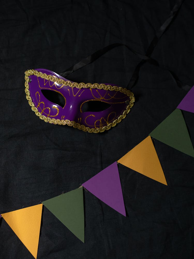 Purple Masquerade Mask Near Banners 