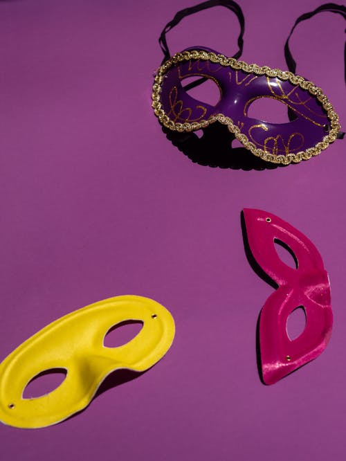 Free Masquerade Masks in Purple Background Stock Photo