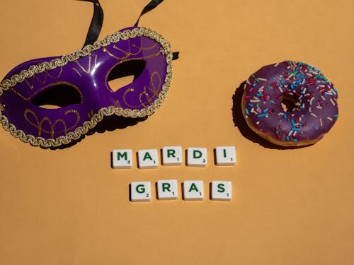 Purple and Gold Mask beside Purple Donut