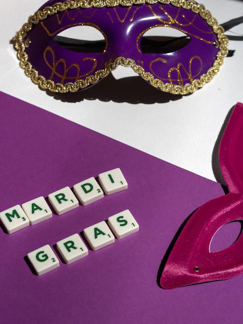Free Close-Up Shot of Mardi Gras Masks and Text Stock Photo