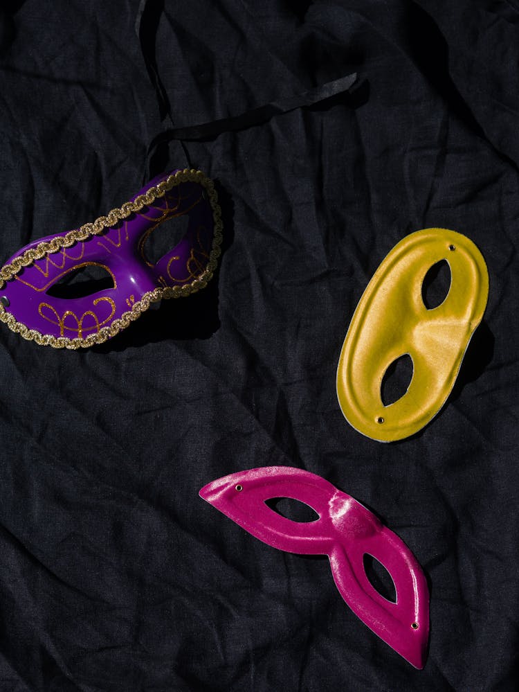 Colorful Masks On Black Textile