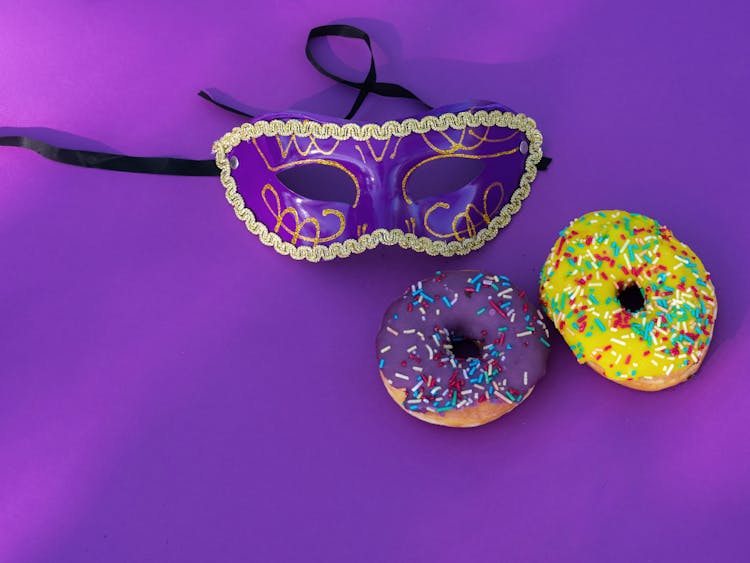 Purple Eye Mask Near The Donuts