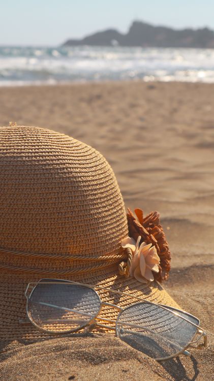 Brown Straw Hat and Sunglasses on Brown Sand · Free Stock Photo