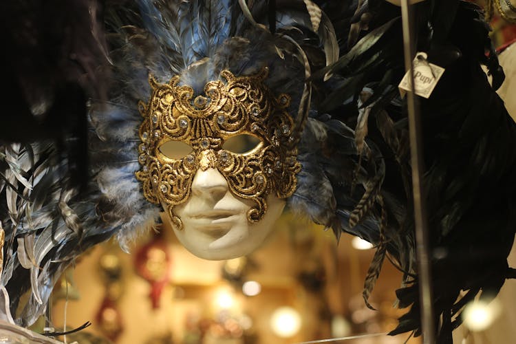 Close Up Of A Golden Venetian Mask With Plume