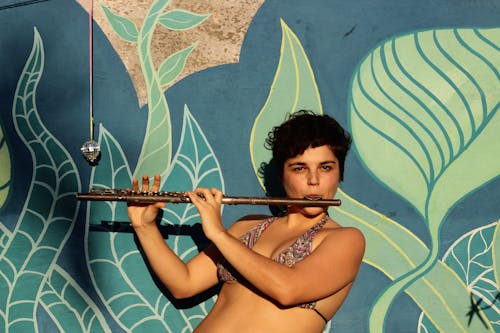 Free A Woman using Flute Stock Photo