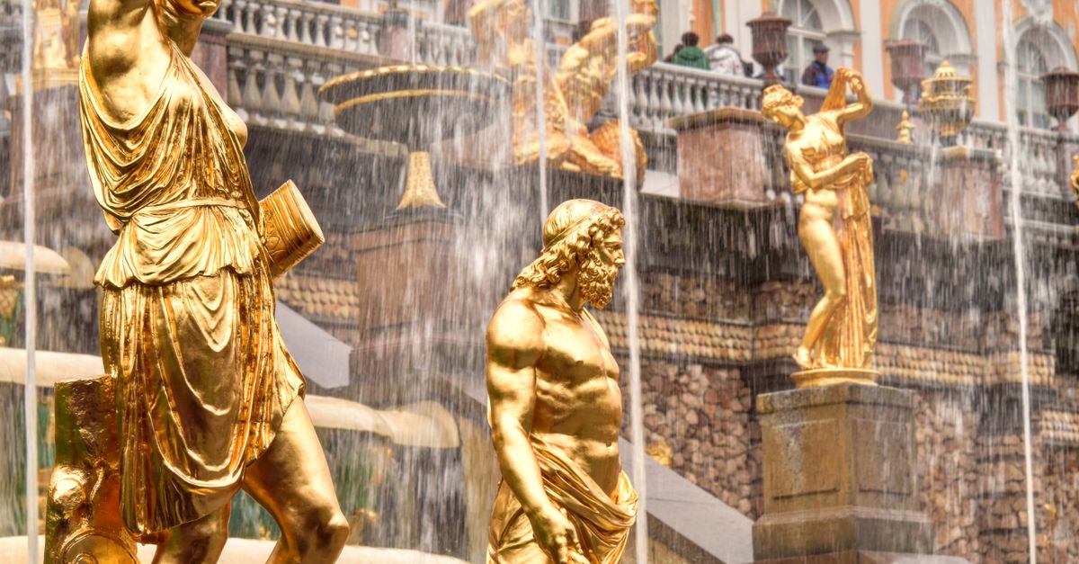 Two Gold Statues Gold Statues in a Fountain and Building Facade · Free Stock Photo