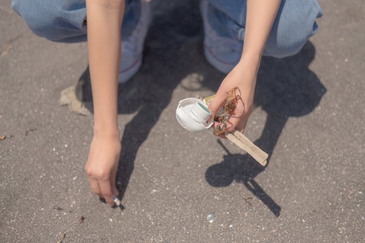 Person Picking Up Trash