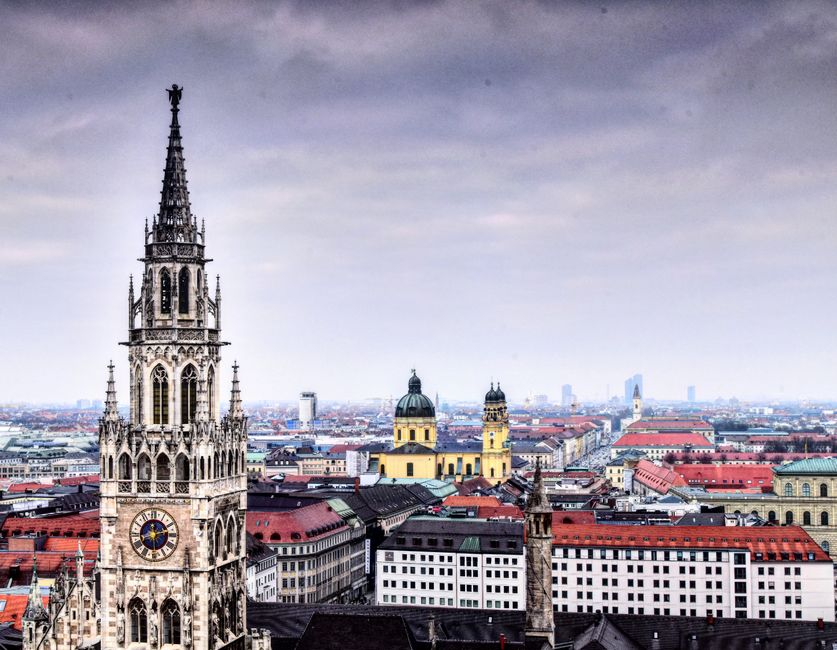Panoramic view of Munich with prominent clock tower and historic buildings.