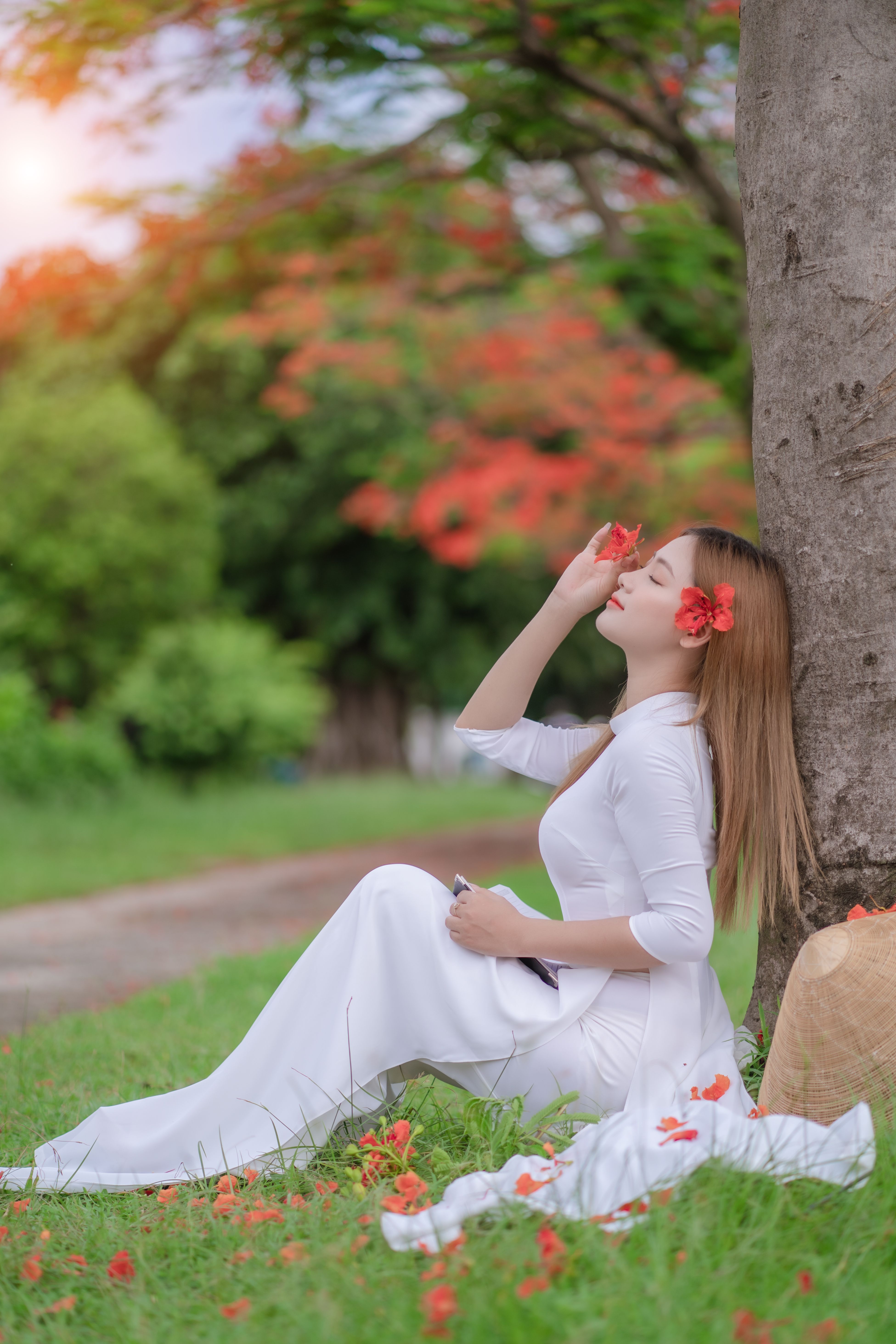 Woman in White Dress Sitting near Tree · Free Stock Photo