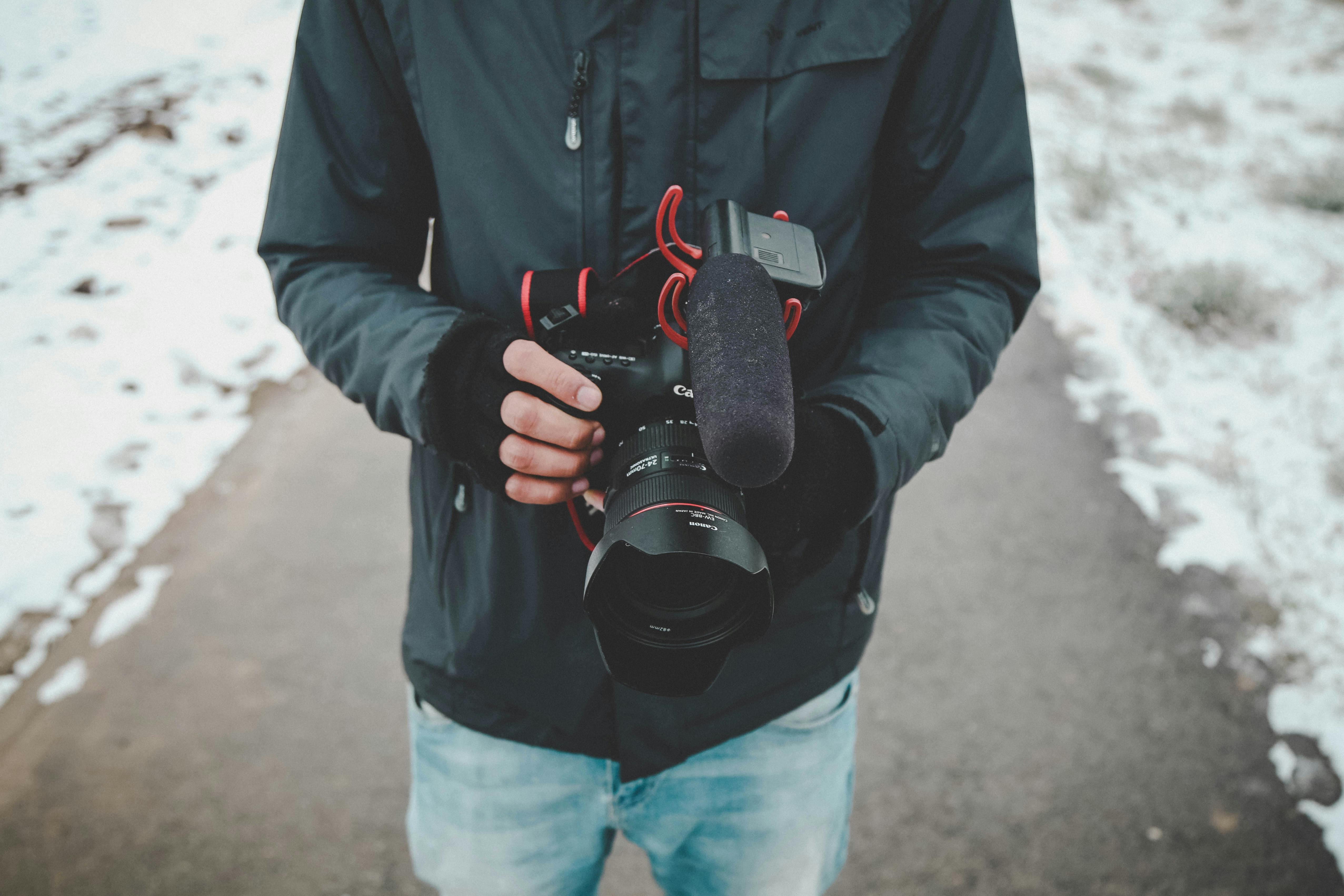 Man Holding Dslr Camera · Free Stock Photo