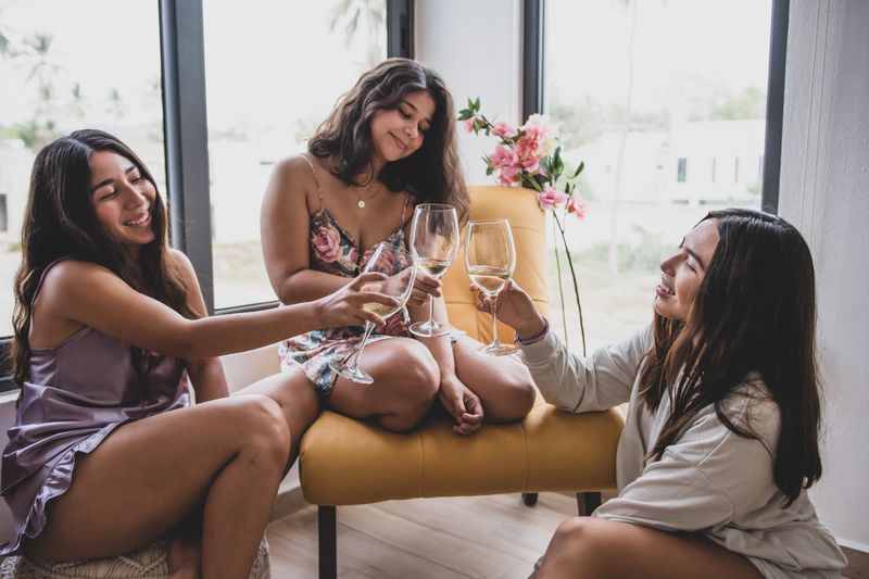 Friends toasting with wine glasses in celebration