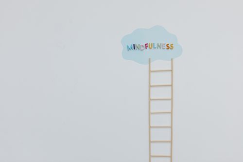 Free Creative mindfulness concept with a ladder and cloud on a minimalist white backdrop. Stock Photo