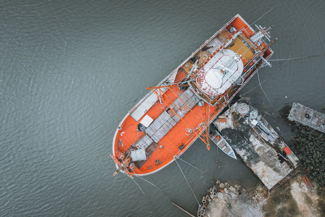 Aerial View of Boat Docked in Harbor · Free Stock Photo