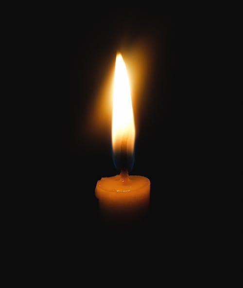 
A Close-Up Shot of a Lighted Candle