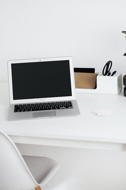 Macbook Air on White Table