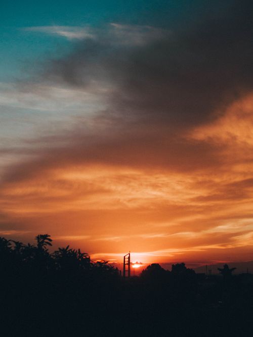 Free A stunning sunset with dramatic clouds and vibrant colors in Buon Ma Thuot, Vietnam. Stock Photo