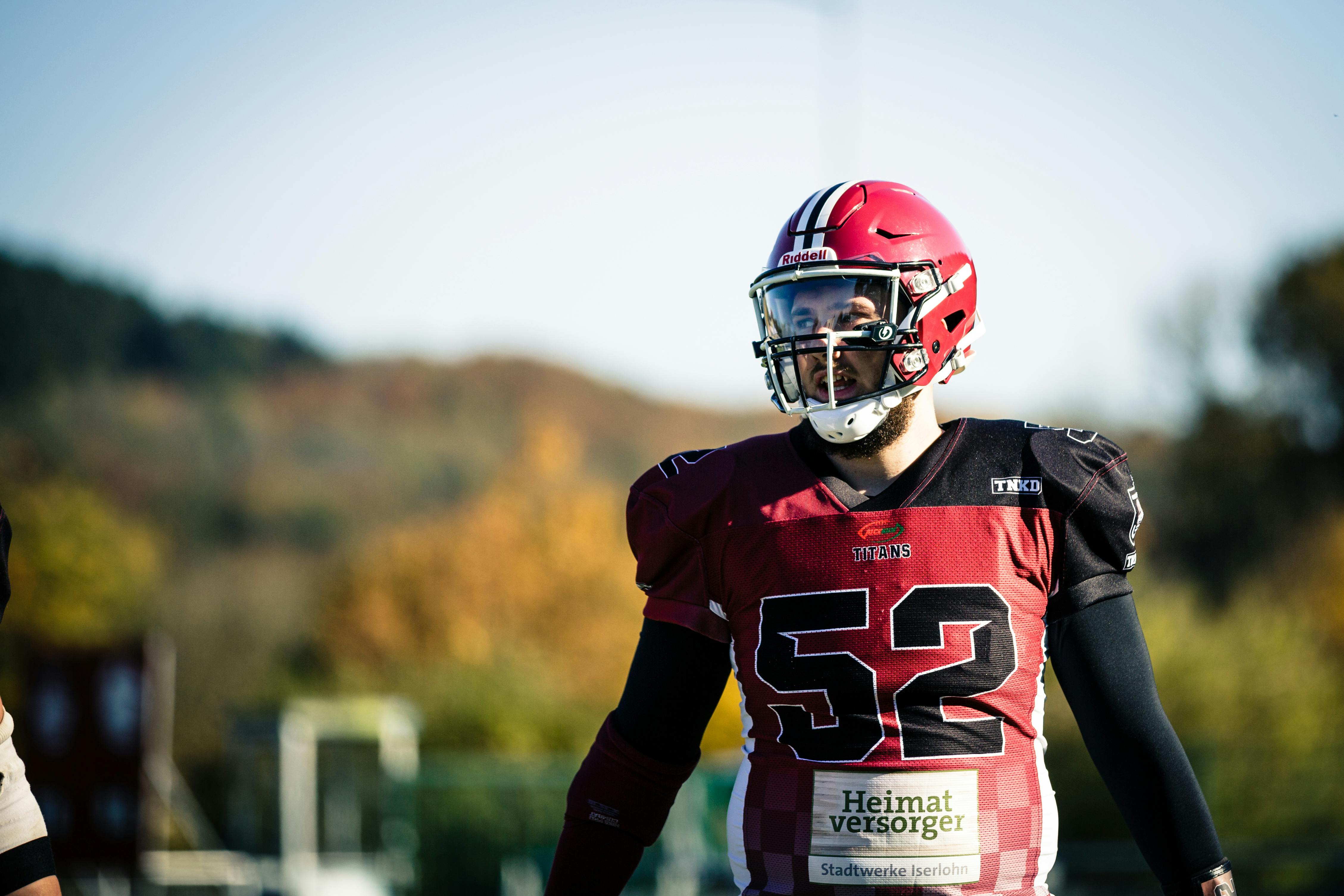 Selective focus photography of boy wearing American football gear photo –  Free Helmet Image on Unsplash