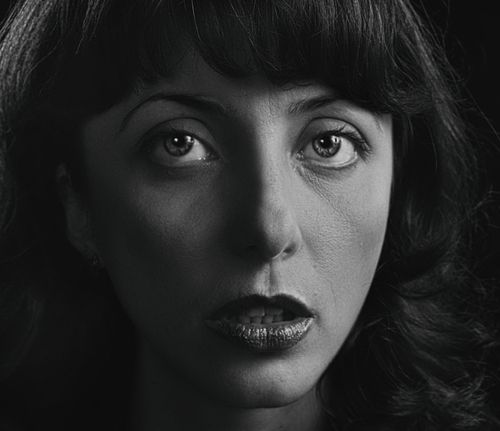 Free Dramatic black and white close-up portrait of a woman with expressive eyes. Stock Photo