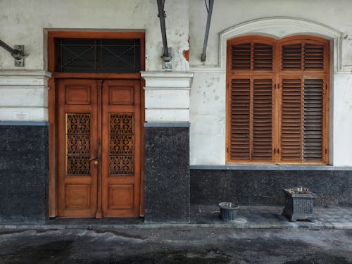 Brown Wooden Door and Windows on Concrete Wall