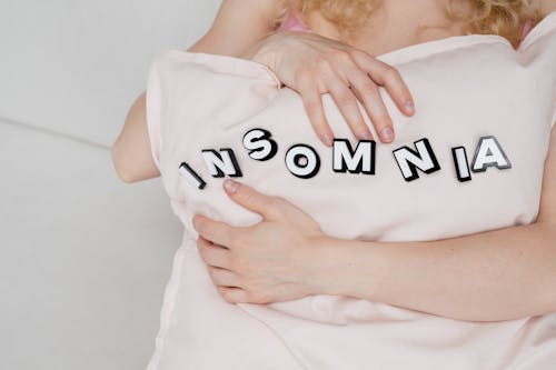 Free Woman Hugging a Pillow Stock Photo