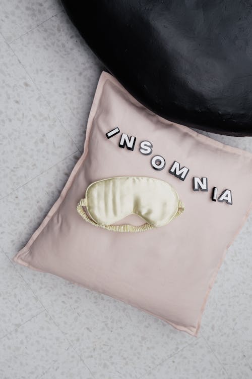 Free Sleep Mask on Top of a Pillow Stock Photo